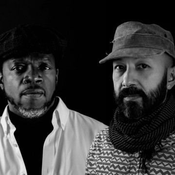 Black and White image two males in hats