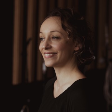 Woman smiling black top