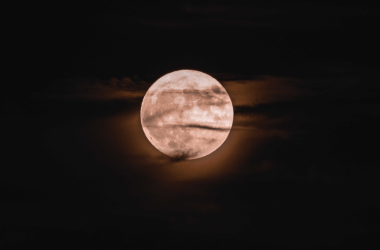 Black night sky with full moon in centre
