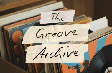 The Grove Archive title on pieces of tape against box of vinyls