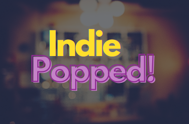 Indie Popped yellow and pink text against blurred pub background