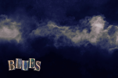 Smoke with a blue tint on black background. Blues text in left hand corner