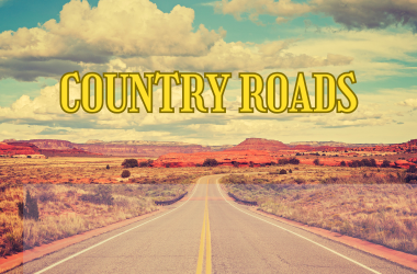 Country Roads in yellow text against an desert country road