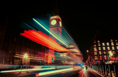 Big Ben at night with blurred/glared lights streaming across
